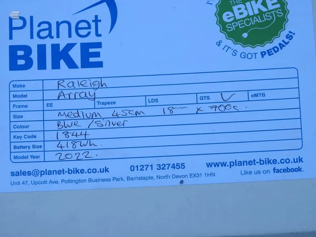 Planet Bike eBike Specialists label form with handwritten bike details including make, model, frame type, size, colour, key code, battery size, and model year.