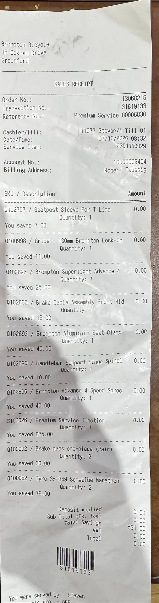 Sales receipt from Brompton Bicycle shop, printed on white paper, showing itemised service work and parts with SKU codes, quantities, and savings applied.