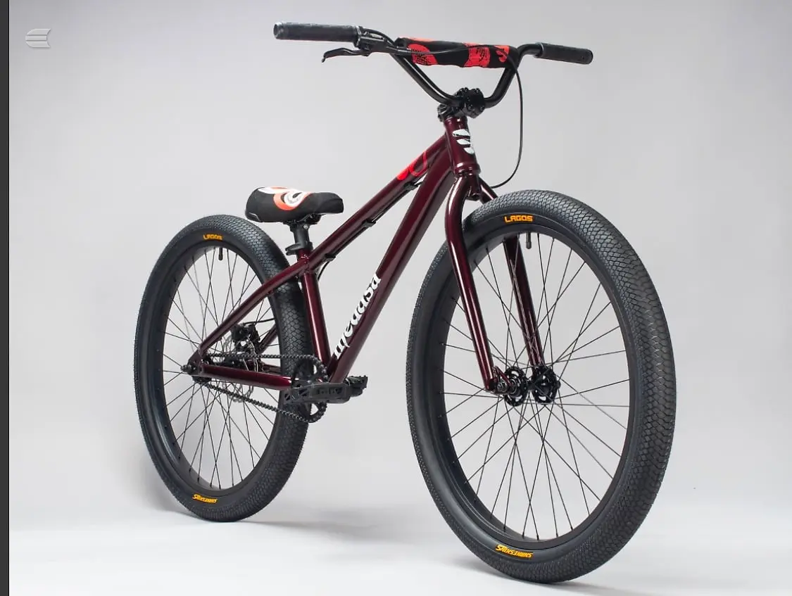 Maroon hardtail mountain bike with red and black handlebar grips, drive side, against a plain white background.